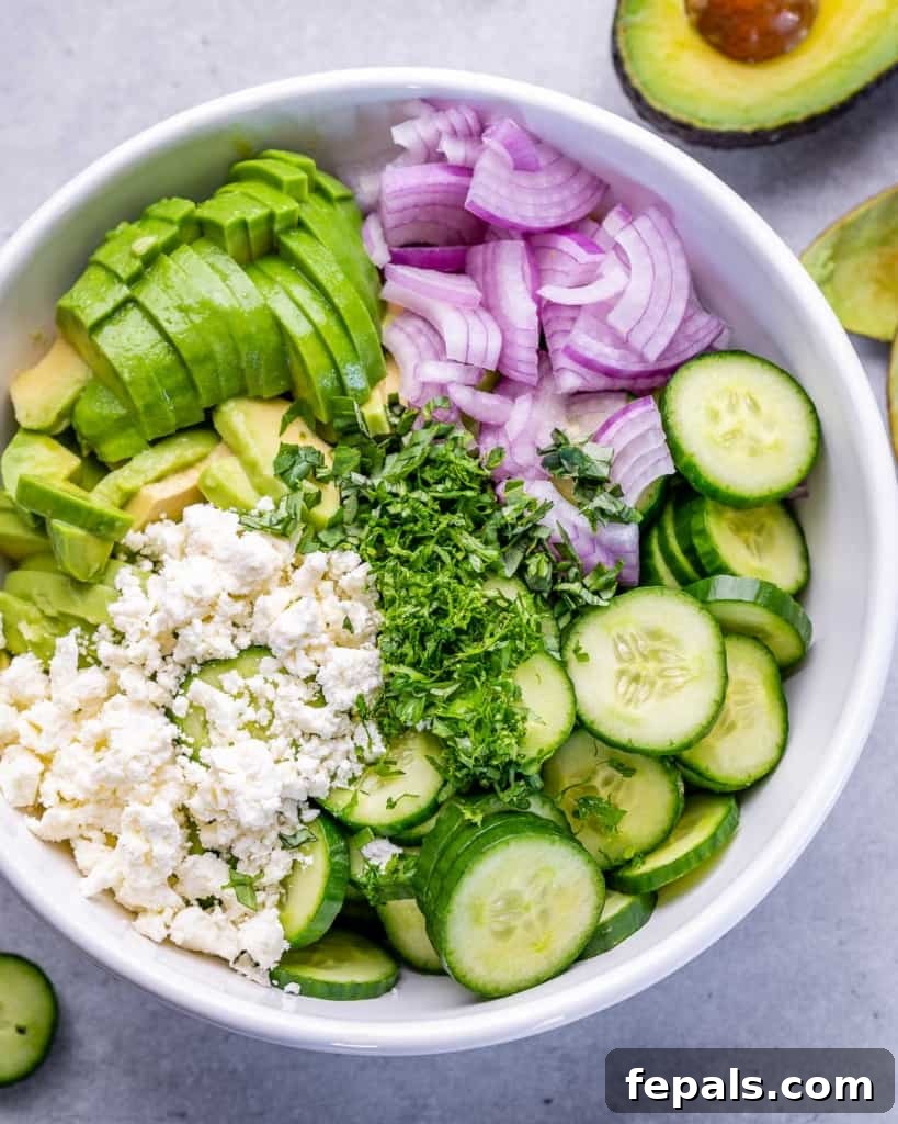 ingredients of salad added to a bowl before mixing