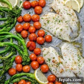 Quick and Easy Baked Tilapia 3 top view of baked tilapia with tomatoes and broccolini