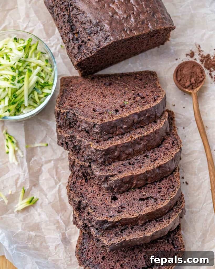 top view sliced chocolate zucchini bread on parchment paper