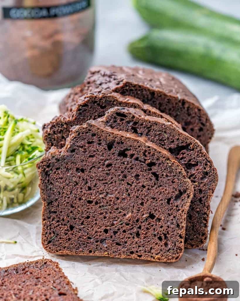 side shot of sliced zucchini bread
