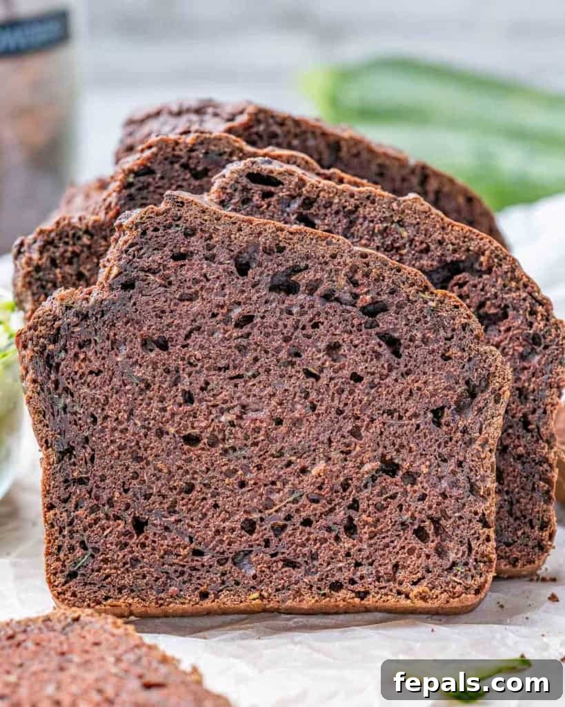 side shot of sliced zucchini bread