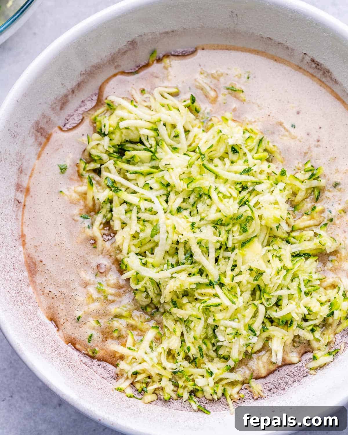 grated zucchini added over batter