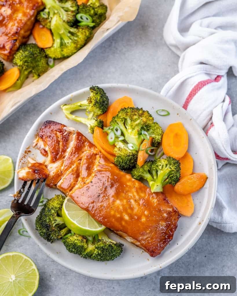 Umami Miso Salmon 8 top view of perfectly cooked miso salmon on a white plate with roasted broccoli and carrots arranged artistically