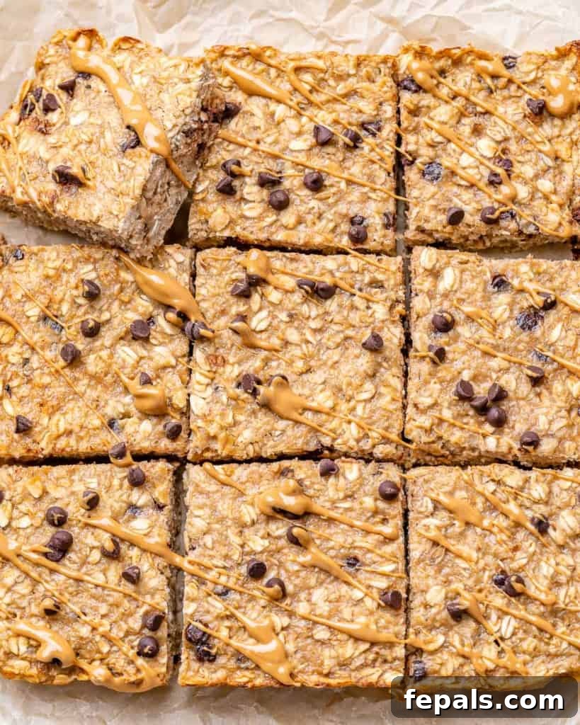 Top view of perfectly cut square chocolate chip oatmeal bars, ready to serve.