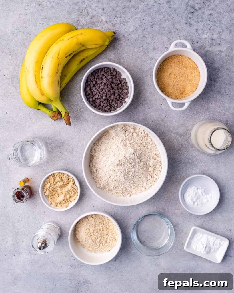 A vibrant display of all the key ingredients needed for vegan banana bread: ripe bananas, dairy-free chocolate chips, coconut sugar, baking powder, baking soda, salt, oat flour, almond flour, water, flax meal, almond milk, and vanilla extract.
