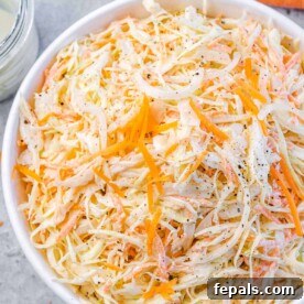 Wholesome Homemade Coleslaw 10 top view close up image of close slaw salad in a white bowl