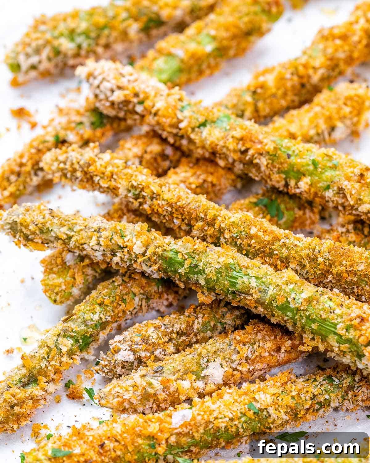 close up of oven baked asparagus on baking sheet. 