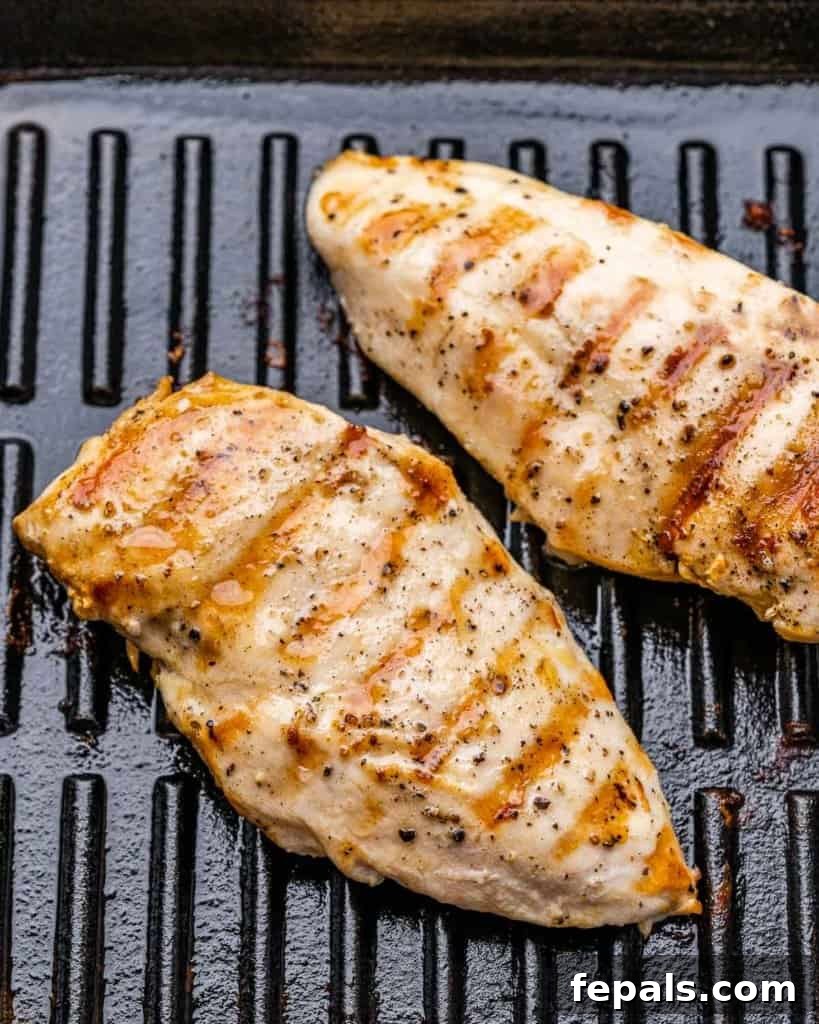 Flame-Kissed Chicken Kale Caesar 5 grilled chicken breast on a grill pan