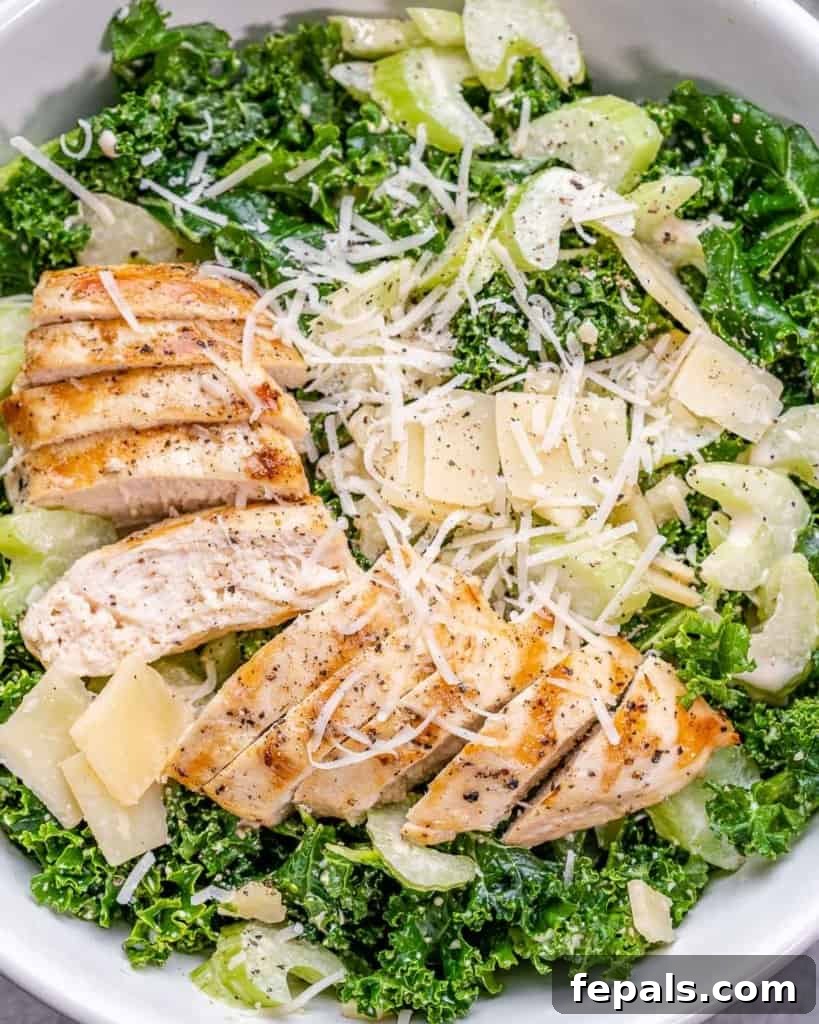 Flame-Kissed Chicken Kale Caesar 8 top view kale salad with chicken in a white bowl