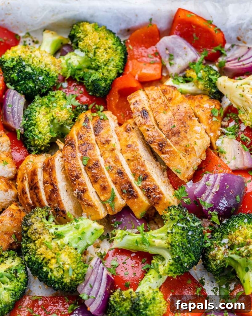 close up sliced chicken breast with roasted veggies 