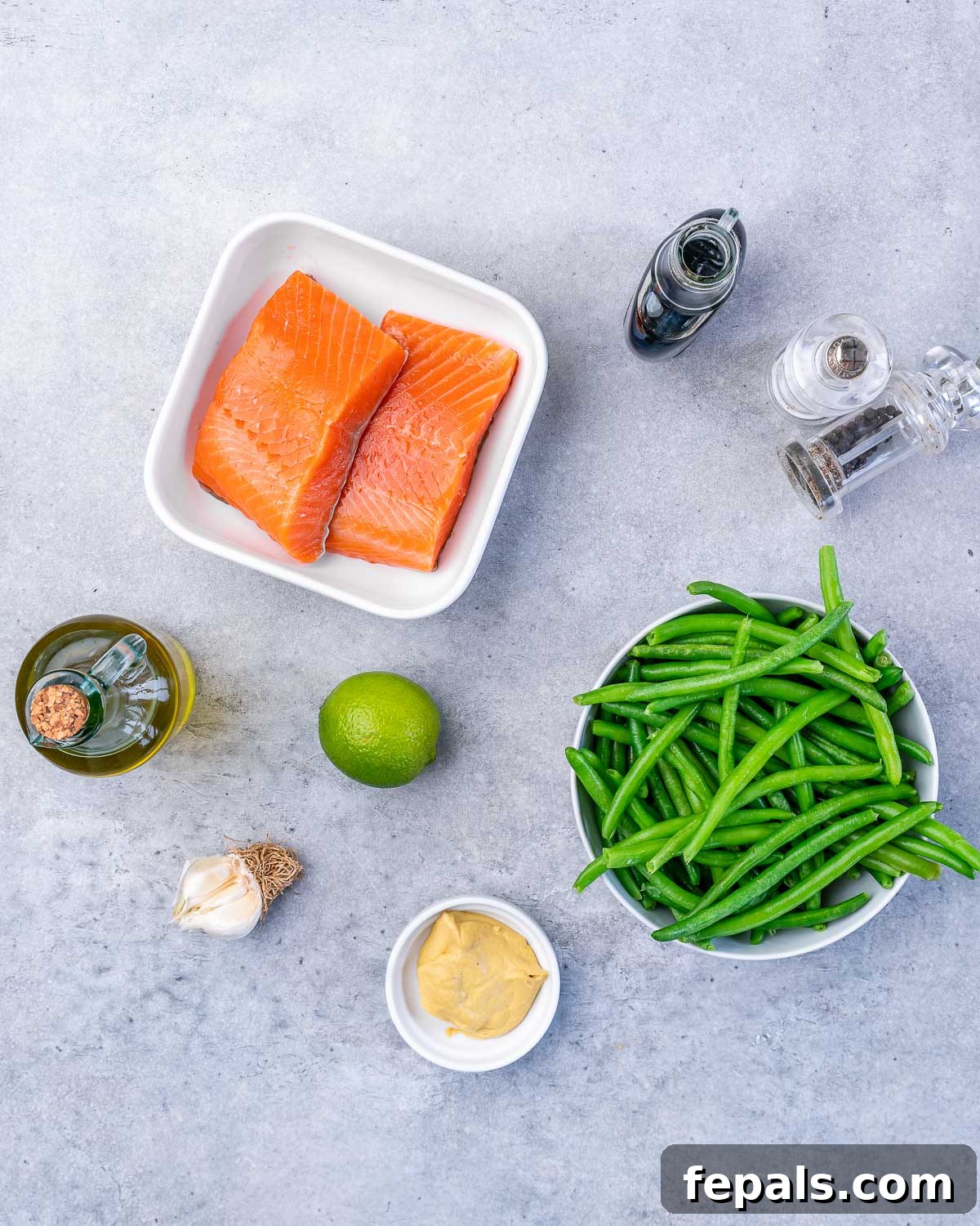 salmon filets, maple syrup, salt, pepper, green beans, mustard, lime, garlic, olive oil 