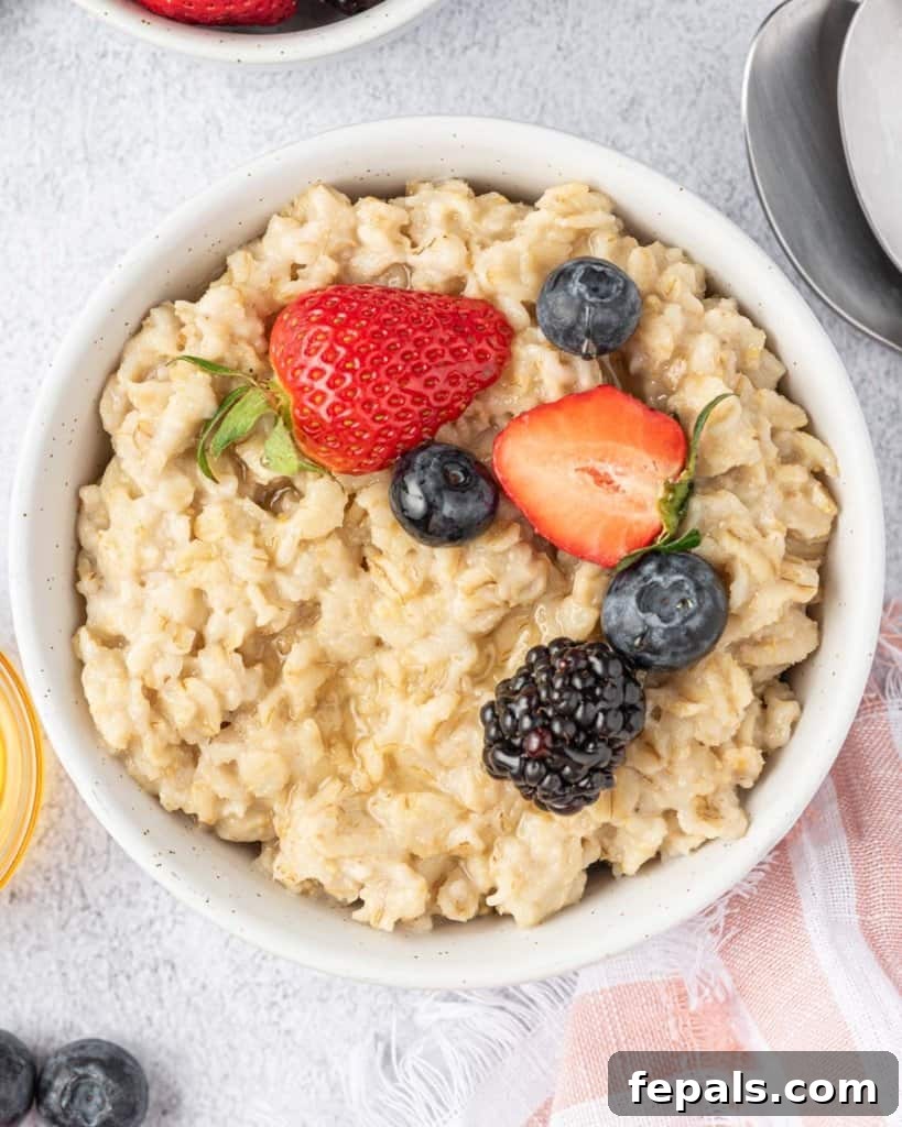 Effortless Instant Pot Oatmeal 11 top view shot of oatmeal in a white bowl