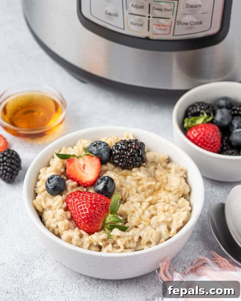 Effortless Instant Pot Oatmeal 12 side shot of oatmeal bowl by the instant pot with a side of fruit bowl