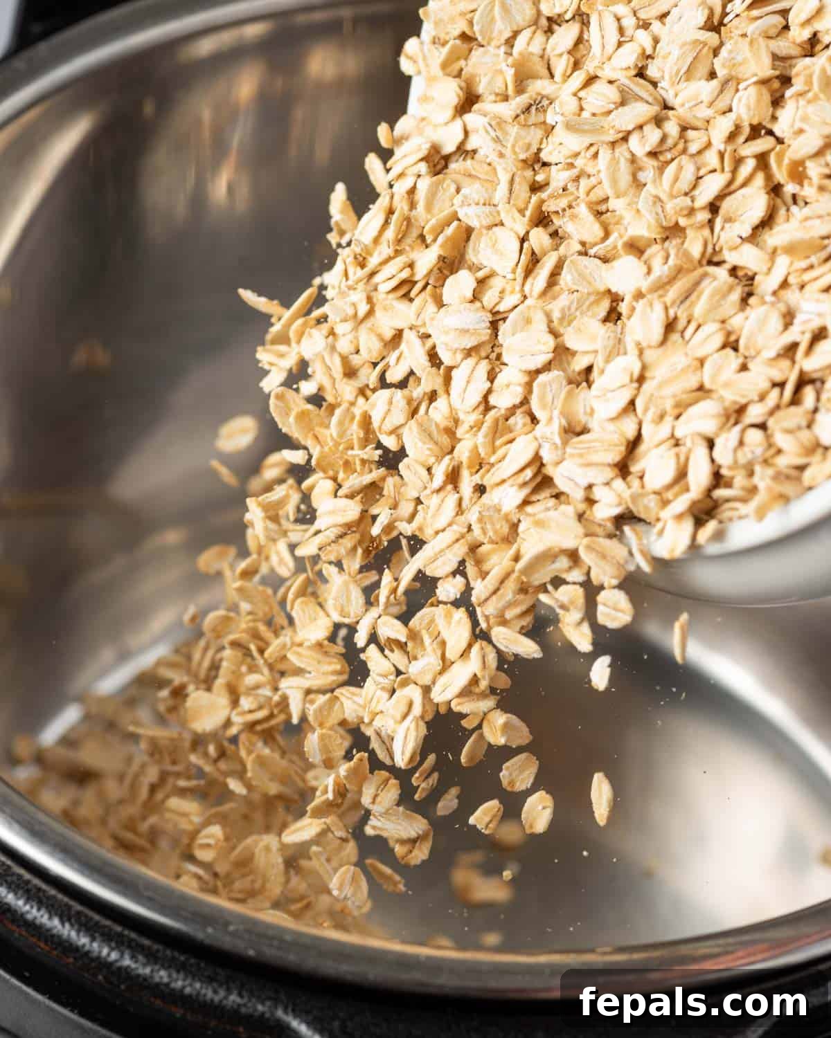 Effortless Instant Pot Oatmeal 5 oats being added into the instant pot.