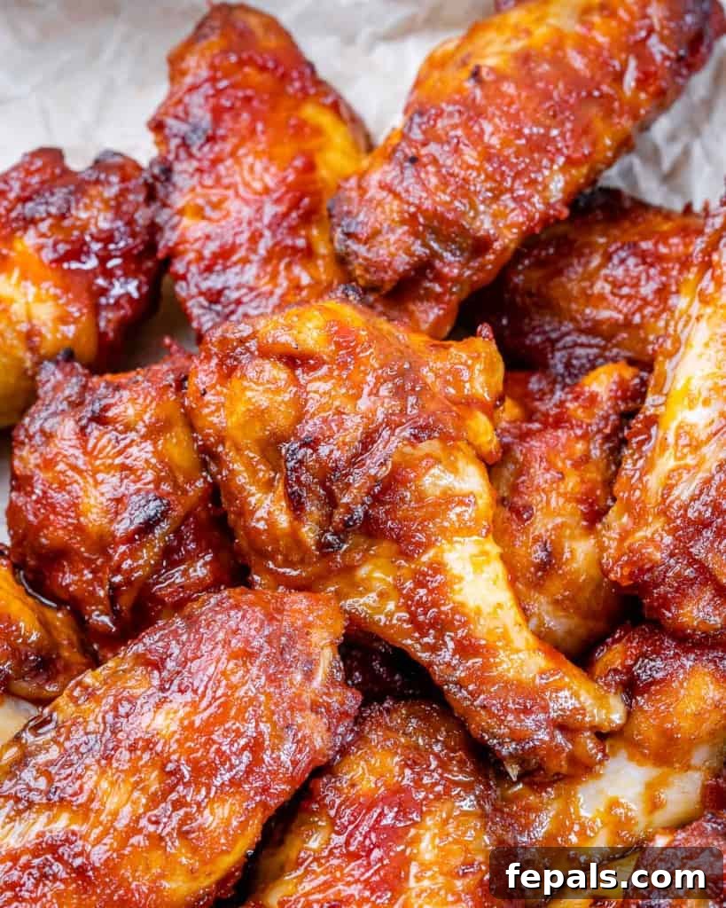 close up of chicken wings stacked on each other 