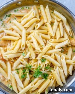 Lighter Chicken Carbonara 15 Pasta over the chicken carbonara sauce, not mixed yet.