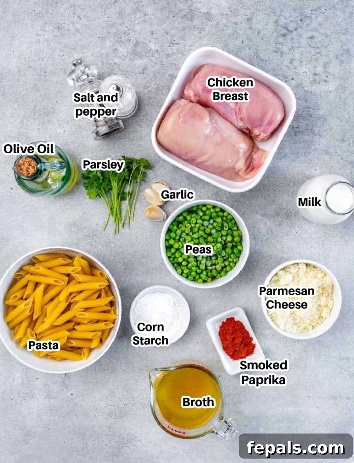 Lighter Chicken Carbonara 4 A flat lay photograph of all the ingredients needed to make chicken carbonara, neatly arranged on a countertop.