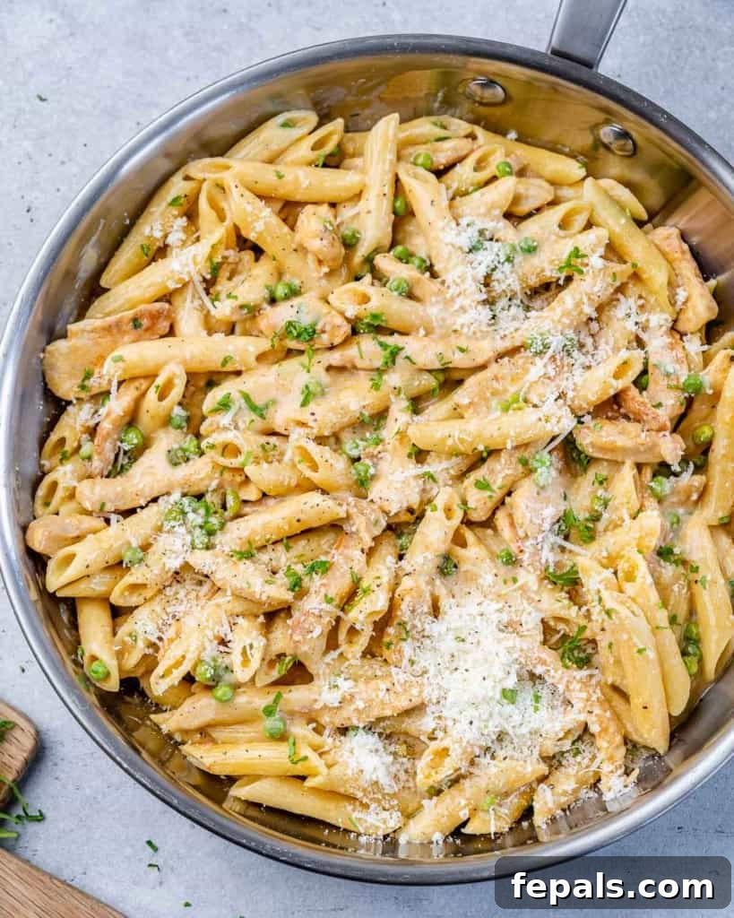 Lighter Chicken Carbonara 8 Top view of chicken and pasta mingling in a stainless steel skillet, ready to be served.