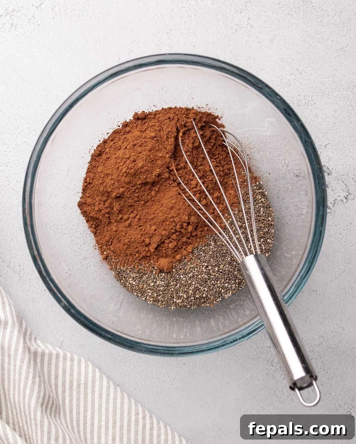 cocoa powder poured over chia seeds