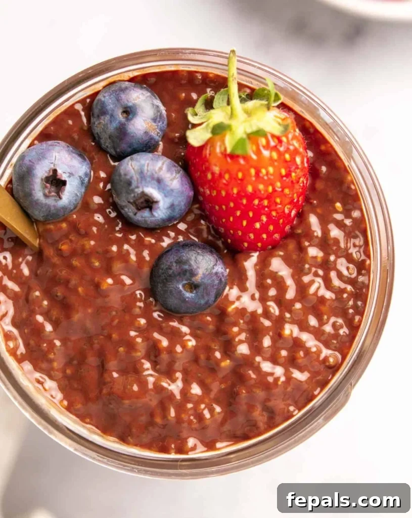 top view chia pudding in a jar topped with berries