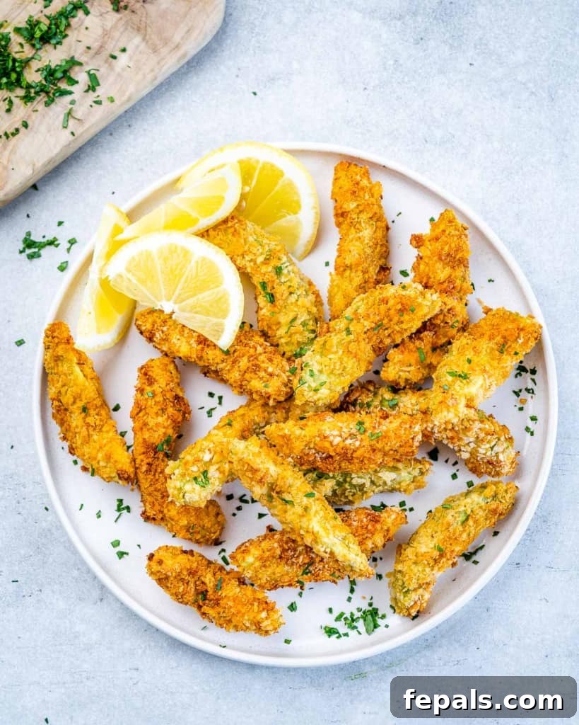 Avocado Golden Fingers 8 top view of baked avocado fries on a plate, garnished