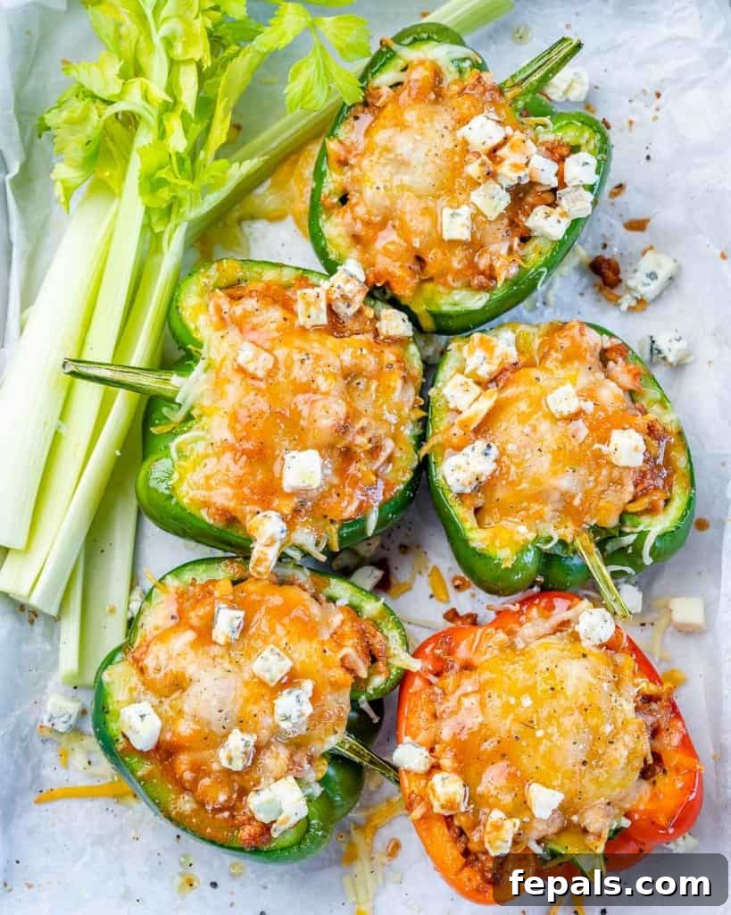 top view of 5 stuffed peppers on a plate