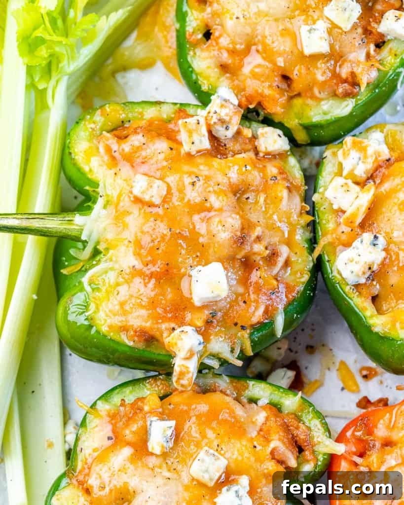 close up  stuffed green pepper topped with melted cheese