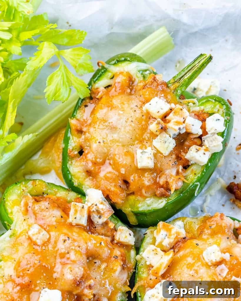 close up image of stuffed peppers topped with cheese
