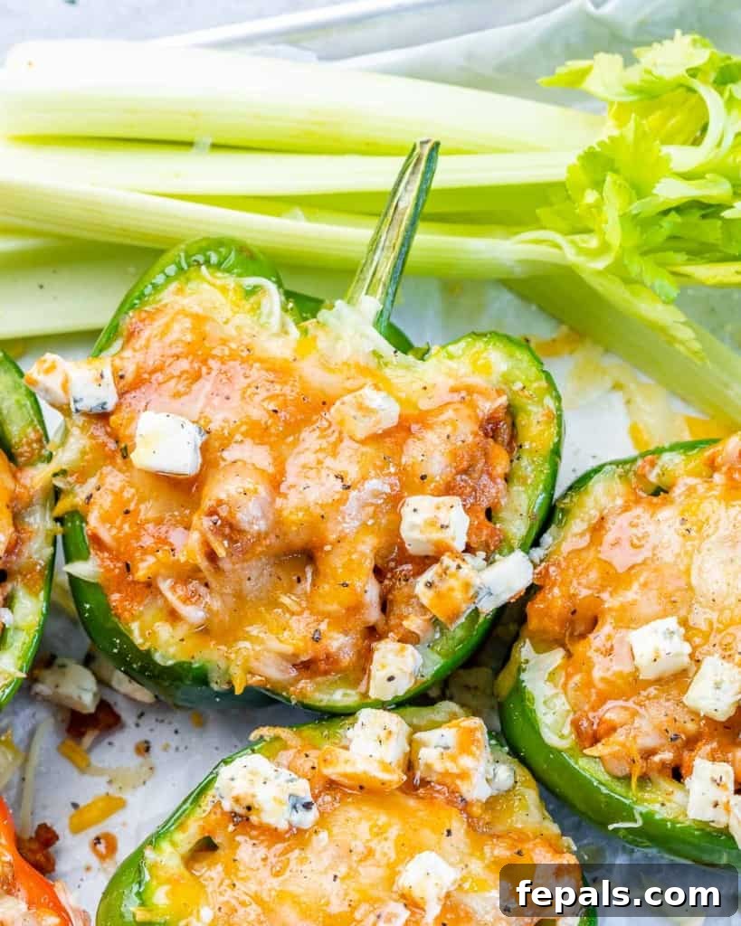 top view of stuffed green bell peppers with melted cheese
