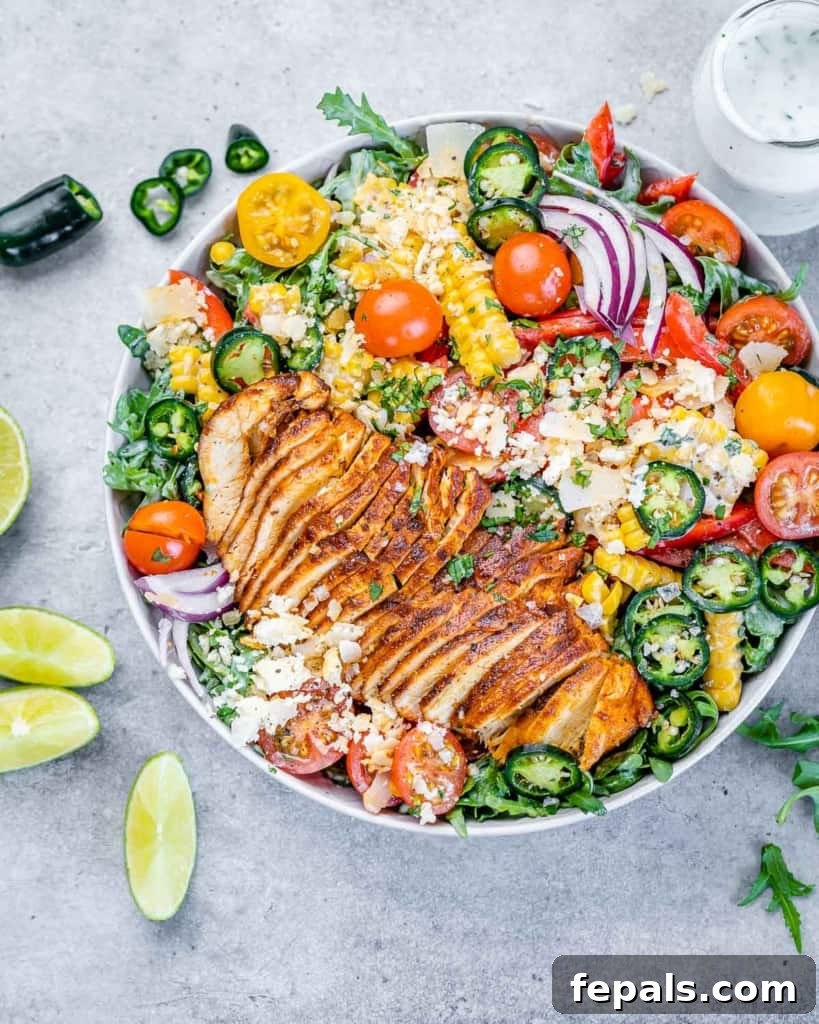 top view chicken salad in a bowl with lime wedges on the side 