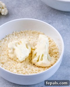 Perfectly Crispy Air Fryer BBQ Cauliflower Wings 17 cauliflower floret in panko crumbs in a bowl
