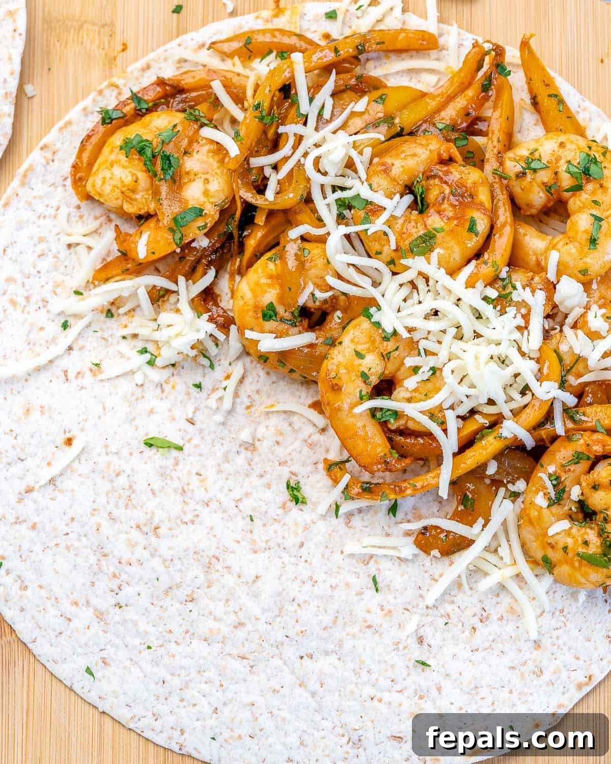 Shrimp Quesadilla Recipe top view of shrimp with shredded mozzarella cheese