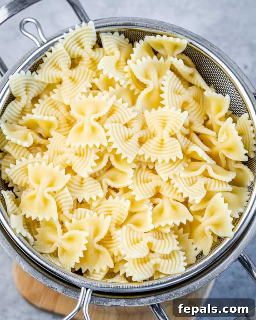 cooked pasta in colander, ready to be added to the sauce