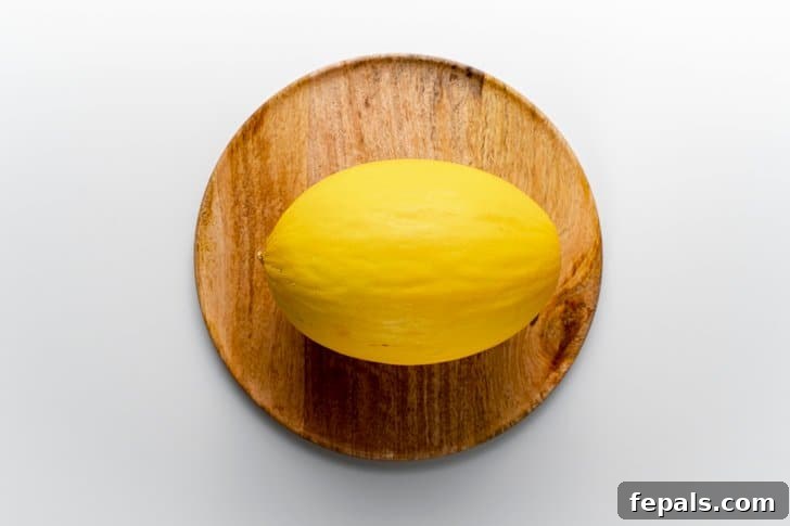 top view of a cantaloupe on wooden plate