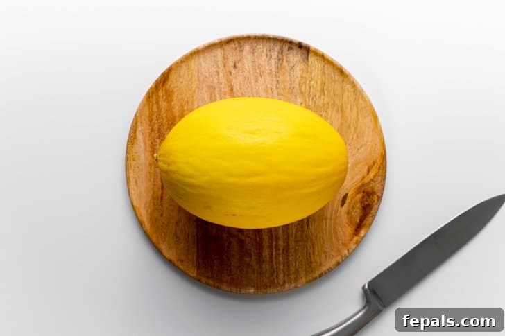 one cantaloupe on wooden tray