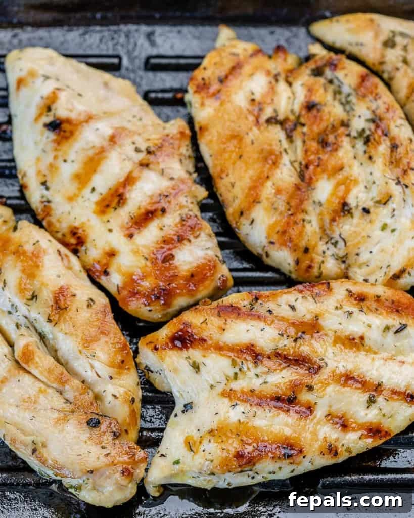 Gourmet Grilled Chicken Sandwich 5 Chicken on a grill.