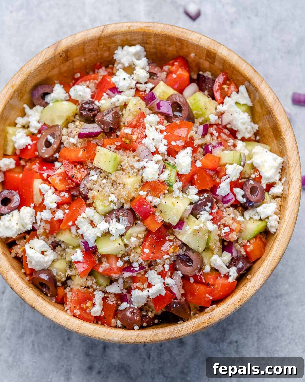 Tossed Greek Quinoa Salad Bowl Recipe Lightly tossed Greek quinoa salad bowl recipe with feta cheese and dressing