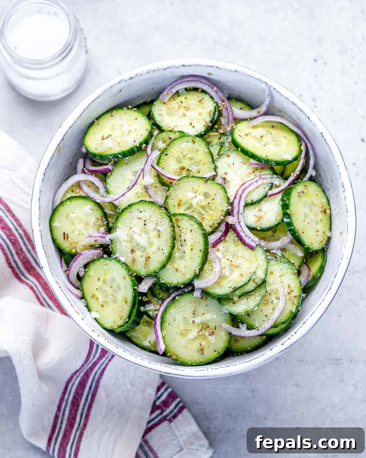 Cucumber Salad With Italian Dressing and Onions top view of cucumber and onions in bowl with Italian dressing