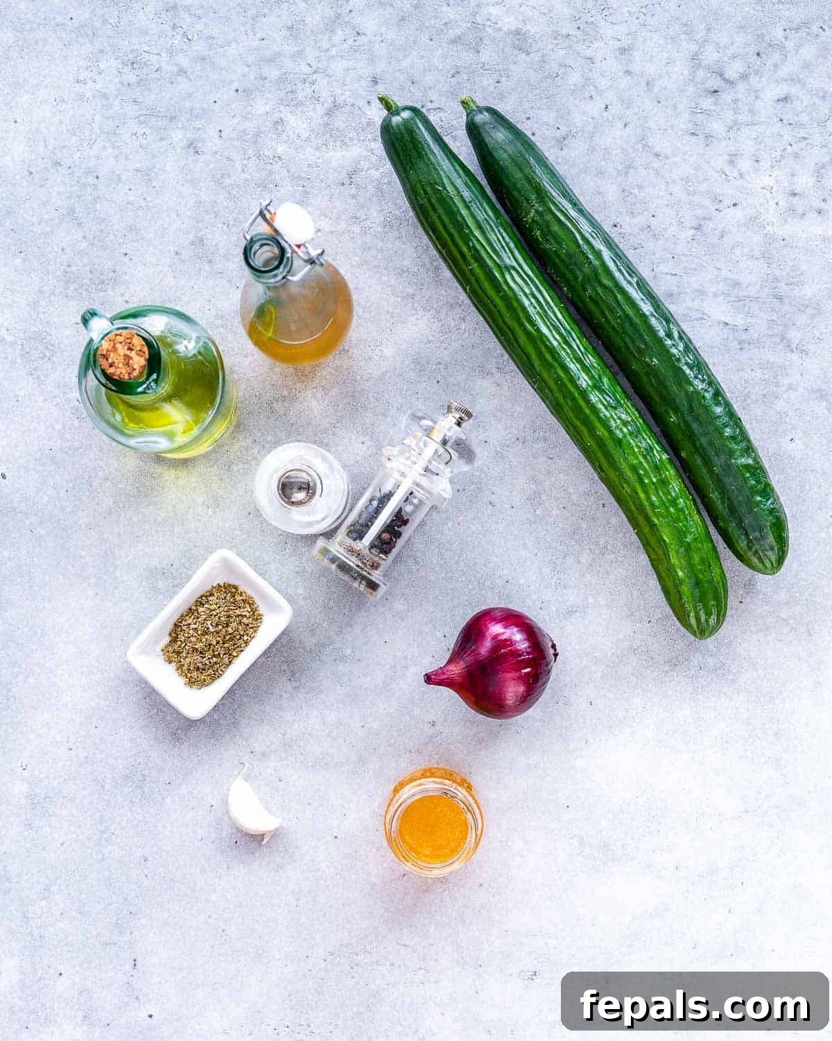 Cucumber and Onion Salad two cucumbers, white wine vinegar, olive oil, salt, pepper, red onion, honey, garlic