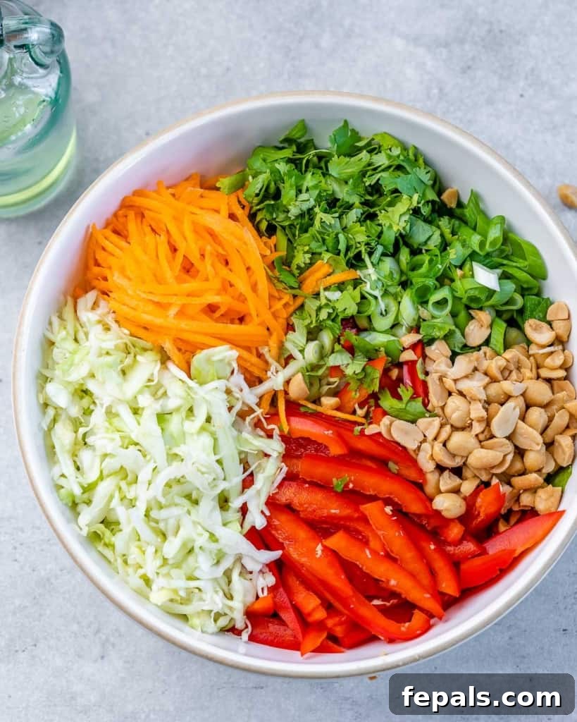 Creamy Thai Peanut Crunch 6 Vegetables and peanuts in a bowl.