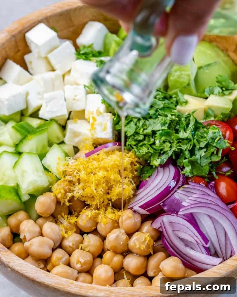 Drizzle oil over the salad ingredients.
