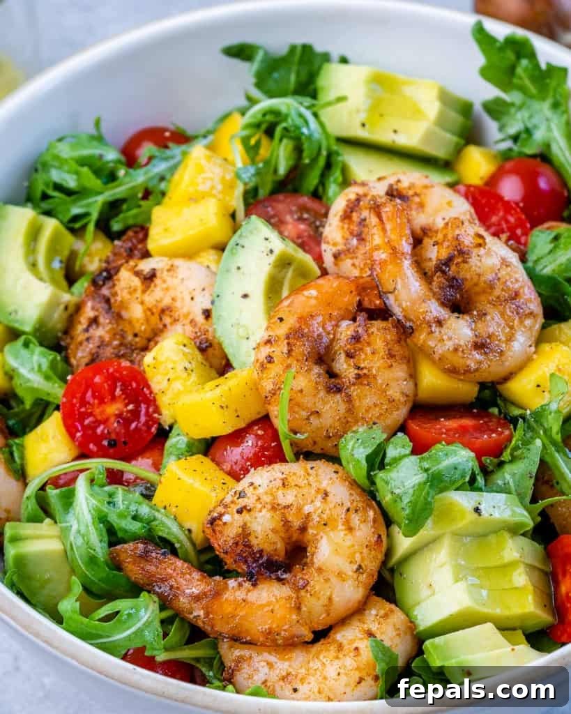 Zesty Grilled Shrimp Summer Salad 3 Close-up of fresh mango, cherry tomatoes, and avocado diced and ready for salad.