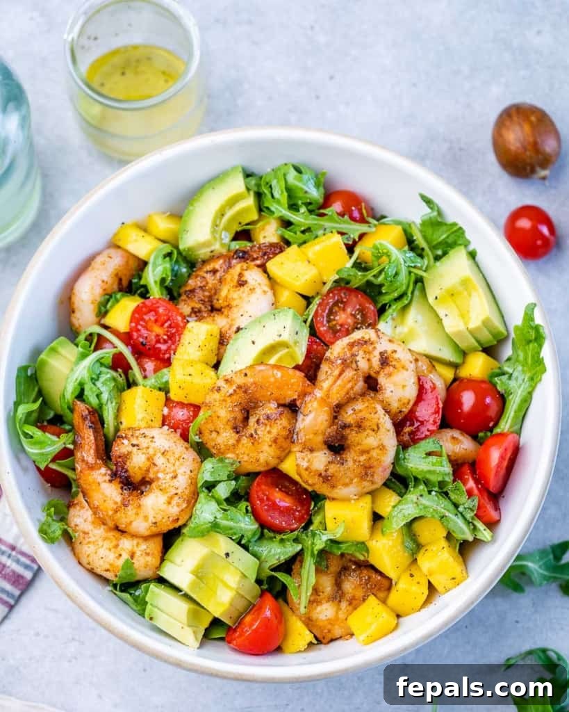 Zesty Grilled Shrimp Summer Salad 8 Close-up overhead view of the Grilled Shrimp Salad with a fork, ready to be eaten.