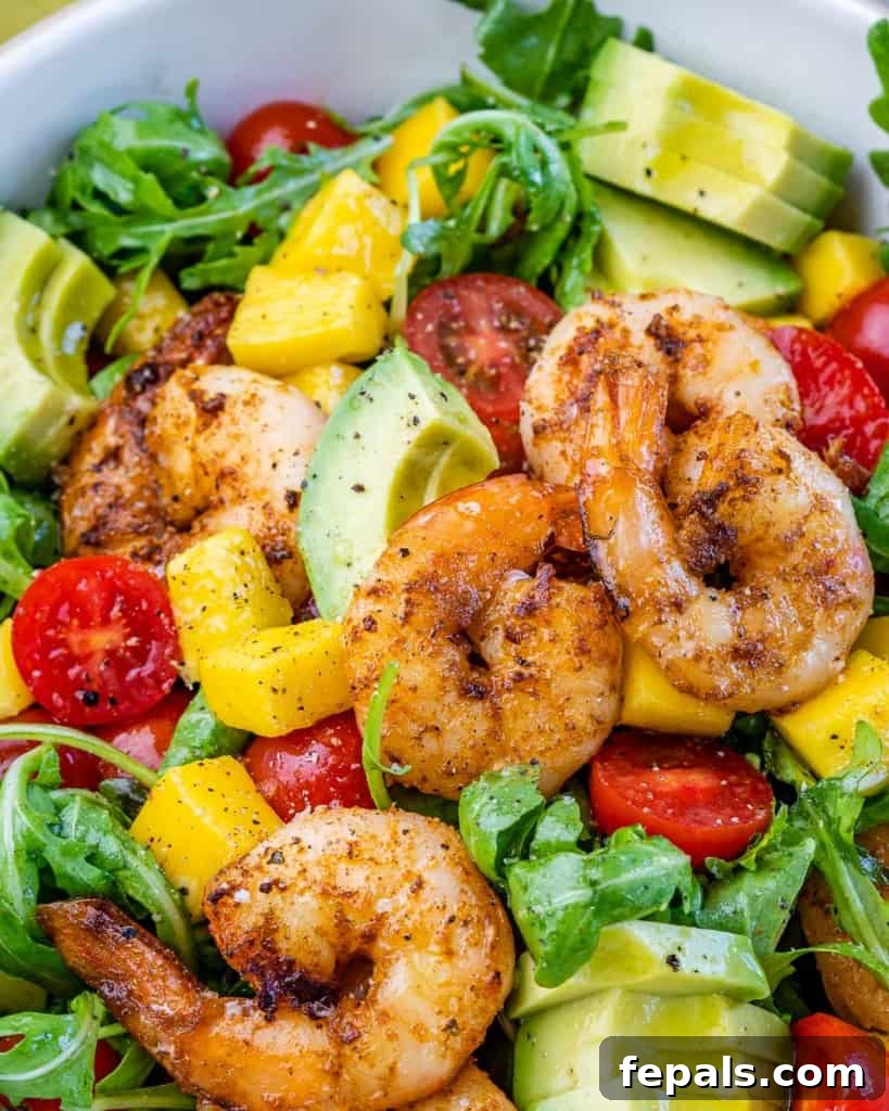 Zesty Grilled Shrimp Summer Salad 9 Close up of a single serving of Grilled Shrimp Salad in a white bowl.