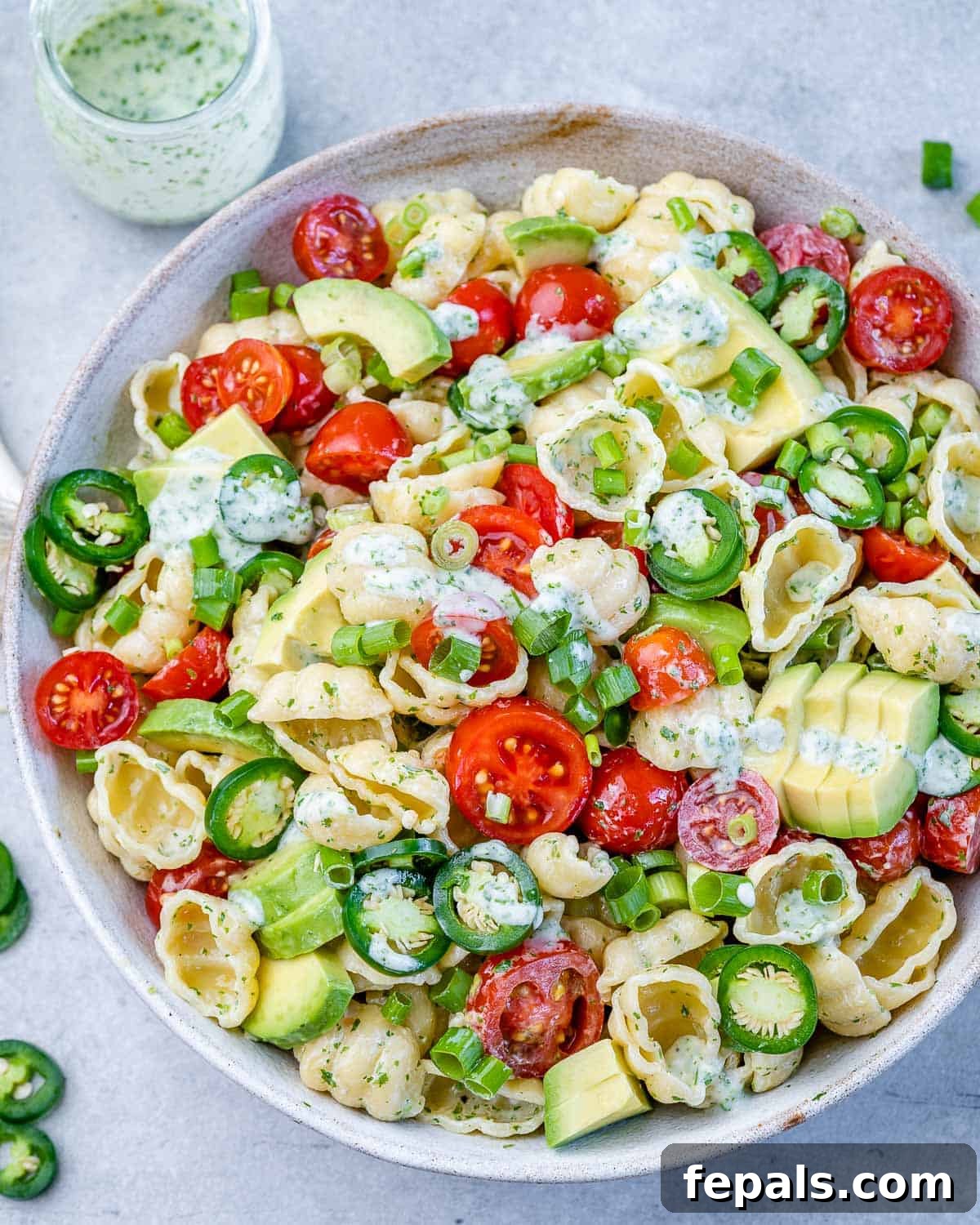 cilantro lime pasta salad in bowl with creamy dressing