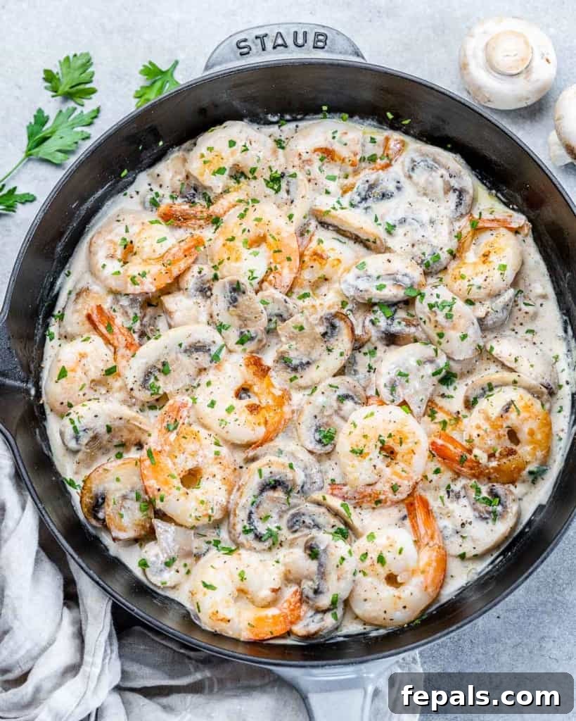 Garlic Shrimp in a Velvety Mushroom Sauce 7 top view creamy shrimp with mushrooms in a black skillet