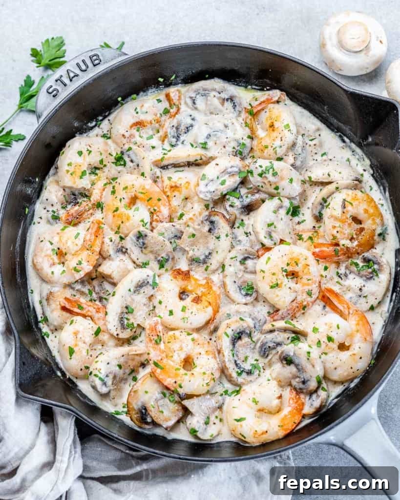 Garlic Shrimp in a Velvety Mushroom Sauce 8 top view of creamy shrimp in a black skillet