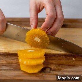 cutting an orange with knife