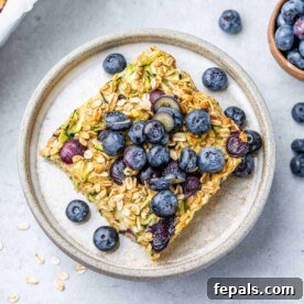 top view of a serving of baked oatmeal topped with blueberries