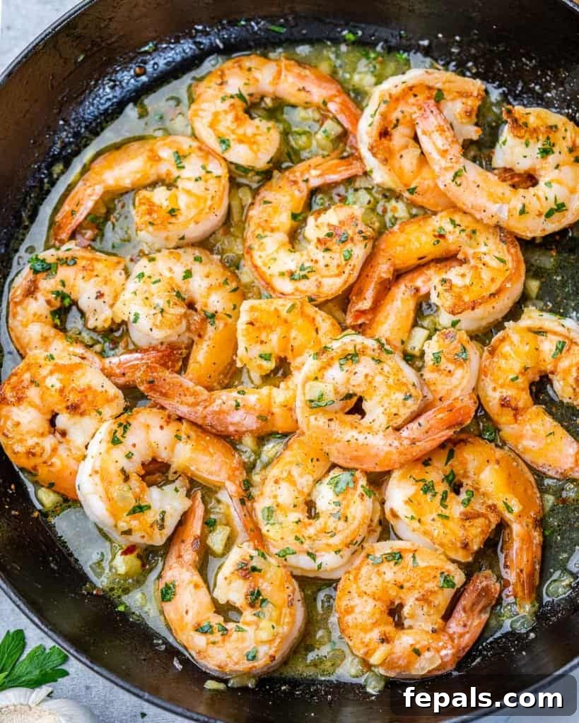 Guilt-Free Garlic Shrimp Scampi 3 Shrimp cooking in a skillet with olive oil and garlic